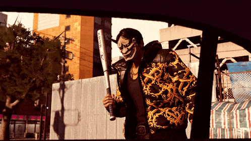 a man wearing a mask is holding a bat that says ' samurai ' on it