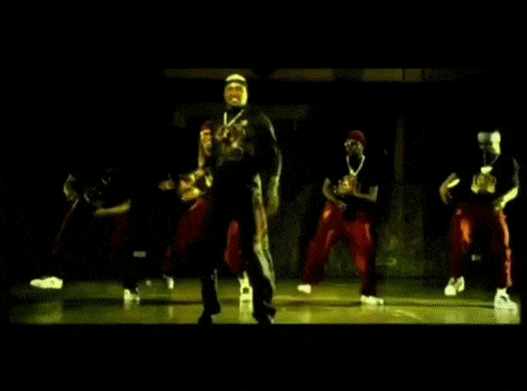 a group of men are dancing together on a stage .