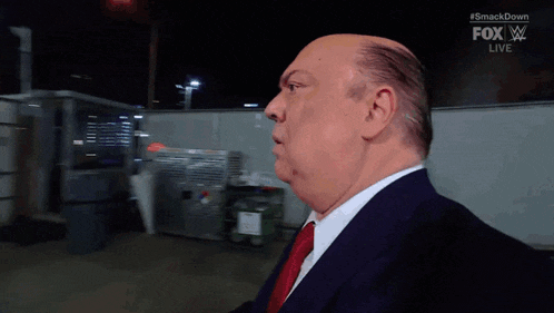 a man in a suit and tie is on a fox live broadcast