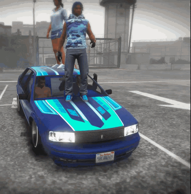 a man standing on top of a blue car with a license plate that says 58ean269