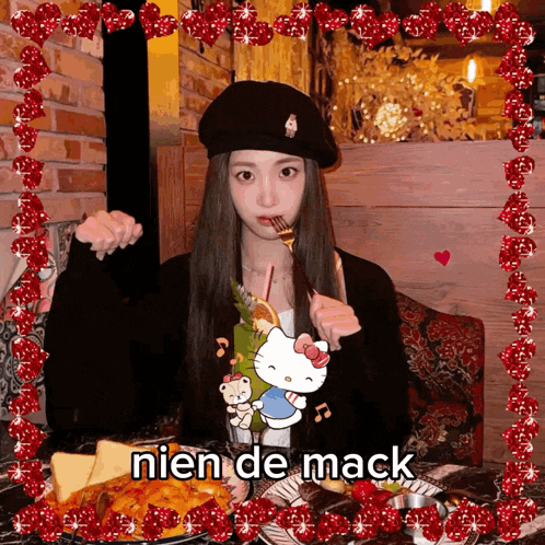 a girl is sitting at a table with a plate of food and the words nien de mack on the bottom