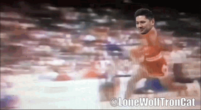 a blurry picture of a basketball player with the words @lonewolftroncat below him