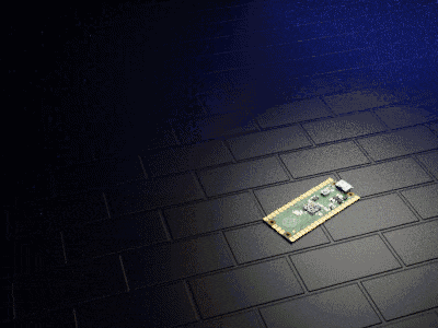 a green and gold motherboard is laying on a black brick floor