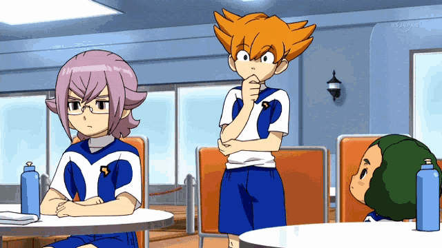 a cartoon of a boy with the letter s on his shirt is sitting at a table