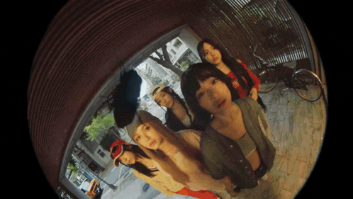 a group of young women are standing in a circle