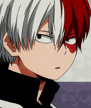 a close up of a person with red and white hair