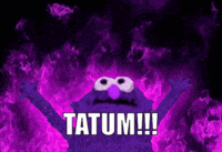 a purple monster with the word tatum written in white