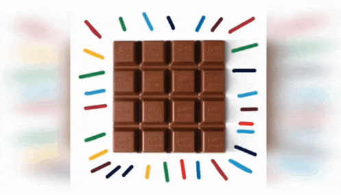 a bar of milky way chocolate surrounded by sprinkles