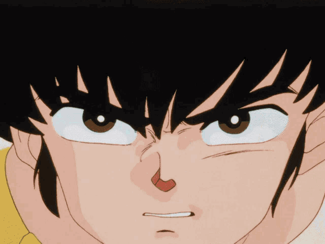 a close up of a cartoon character 's face with a surprised look on his face
