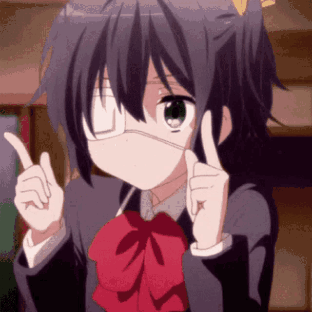 a girl with one eye and a red bow tie is giving a thumbs up