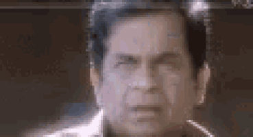 a close up of a man 's face with his eyes closed .