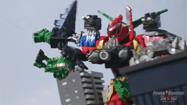 a poster for power rangers shows a group of robots fighting each other