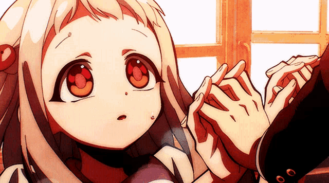 a little girl with red eyes is being held by a man