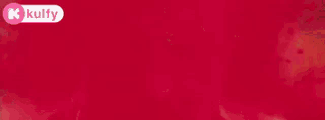 a close up of a person 's face with blood on it and a red background .
