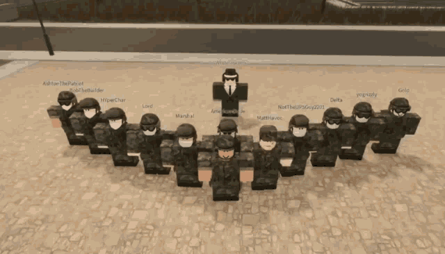 a group of soldiers are posing for a picture and one of them has the name gold written on it