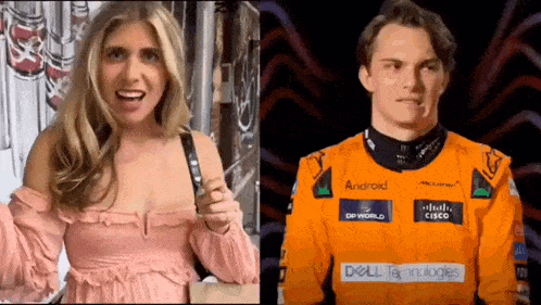 a woman in a pink dress is talking to a man in an orange racing suit .