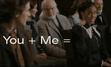 a group of people are sitting in a room with the words `` you + me = '' written on the bottom .