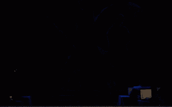 a dark room with a blue light coming out of the ceiling