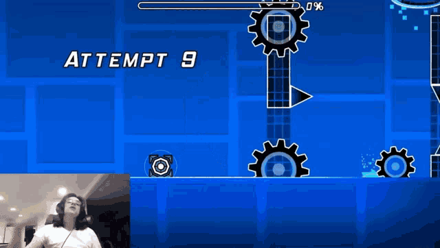 a man playing a video game with the number 9 on the bottom