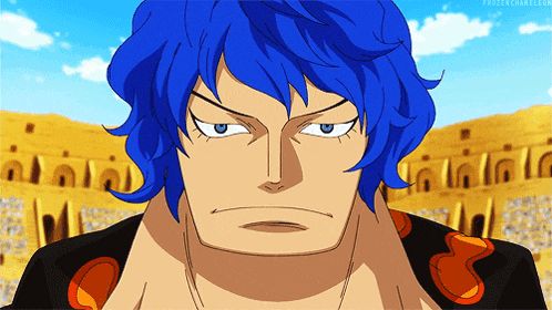 a man with blue hair is looking at the camera with a frozenchameleon.com logo in the background