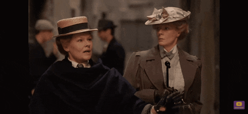 a woman in a hat is blowing her nose