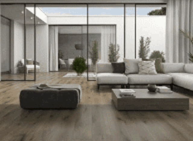 a living room with a couch , coffee table , and ottoman