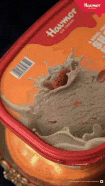a container of haumor ice cream with a splash of cream