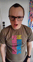 a man wearing glasses and a t-shirt with soc on it