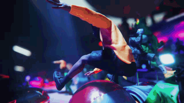 a man in an orange shirt is flying through the air