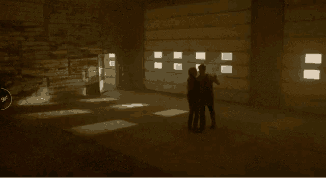 a man and woman are dancing in a dark room with a circle around them that says " off "