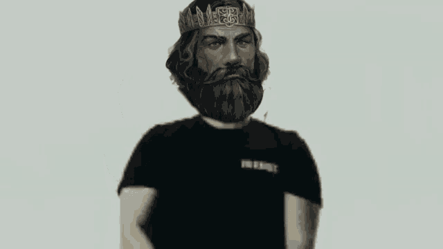 a man with a beard is wearing a crown and holding two guns .