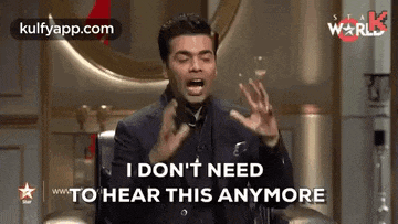 a man in a suit is making a funny face and says i don 't need to hear this anymore .