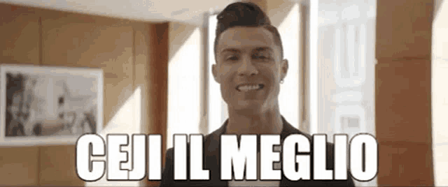 a man is smiling in front of a window with the words " ceci il meglio " written below him