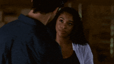 a man and a woman are looking into each others eyes