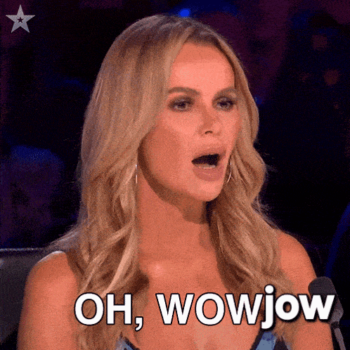 a woman is sitting in front of a microphone with her mouth open and says oh wowjow