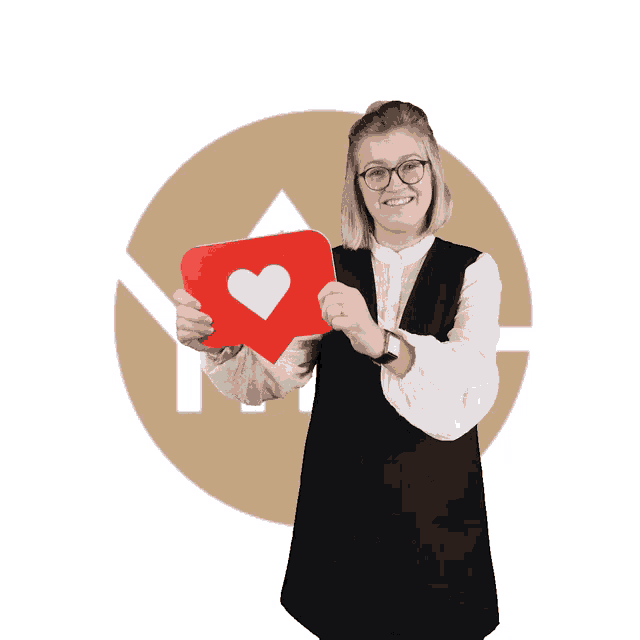 a woman holds up a red heart shaped sign