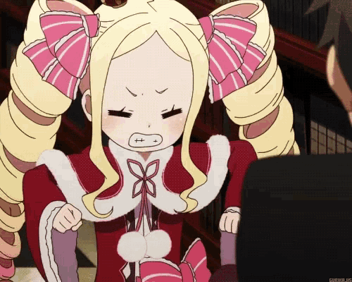 a picture of a girl with a pink bow on her hair