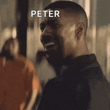 a man is smiling and says peter ok in white letters
