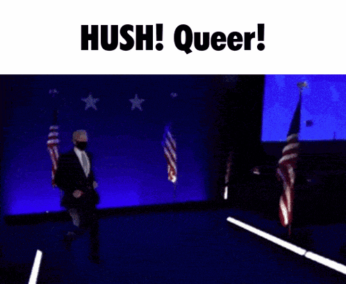 a man in a suit and tie is dancing on a stage with the words hush queer on the bottom