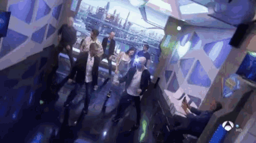 a group of people are dancing in a room that says hd on it