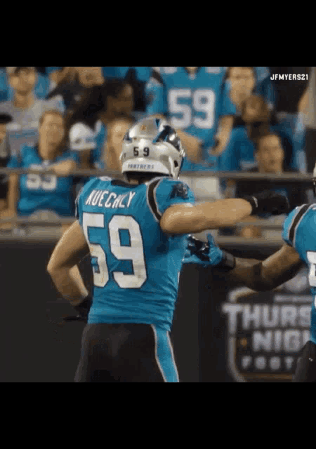 a football player wearing the number 59 jersey