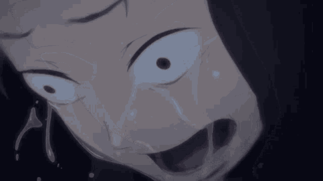 a close up of a person 's face with tears running down it