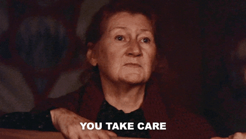 an elderly woman says " you take care " in front of her