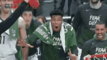 a basketball player wearing a scarf that says fear deer on it