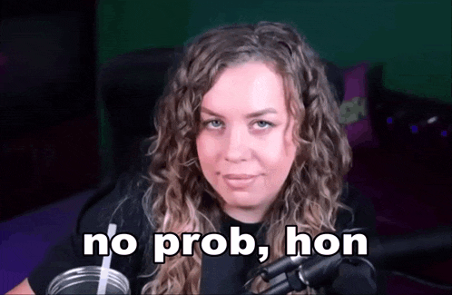 a woman with curly hair is sitting in front of a microphone with the words no prob hon above her