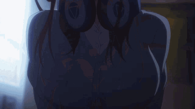 a girl with headphones around her neck has a triangle on her ear