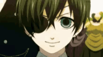 a close up of a boy with green hair and blue eyes wearing a black eyepatch .