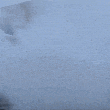 a car is doing a burnout in a parking lot with smoke coming out of it