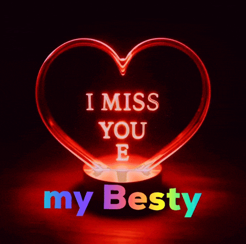 a red heart with the words i miss you e my besty on it