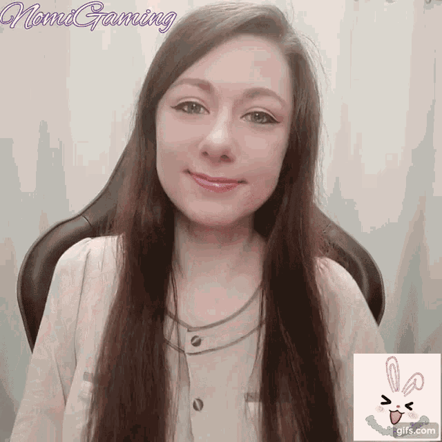 a woman sitting in a chair with the name nami gaming written on the bottom
